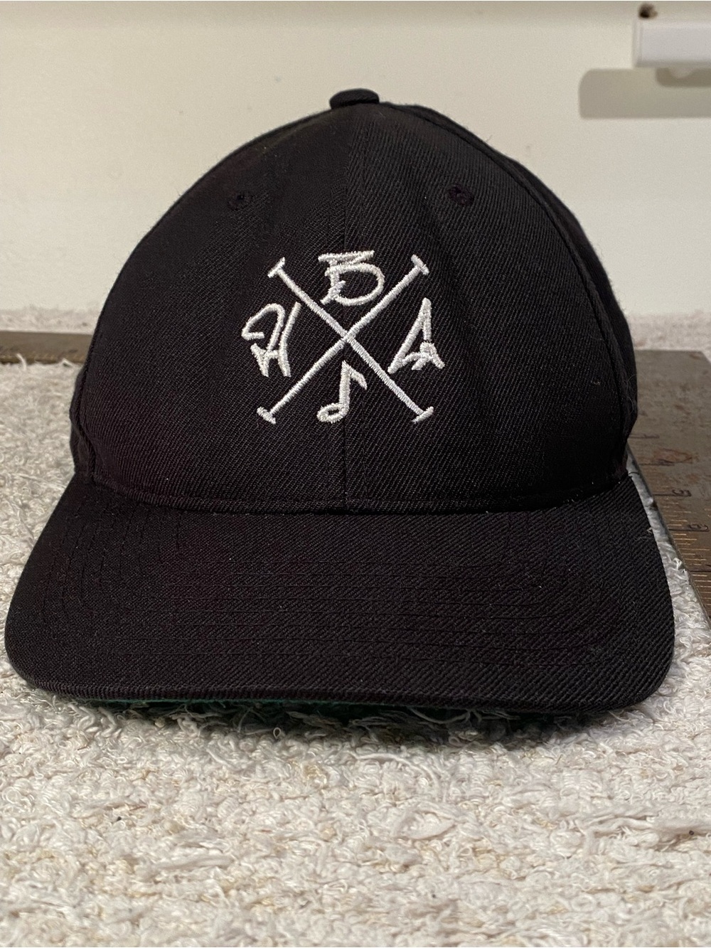 Black Baseball Cap with White Crossed Logo Embroidery